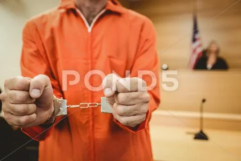 Prisoner in handcuffs clenching fists Stock Photos