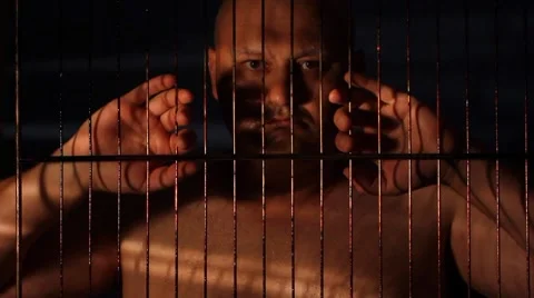 Prisoner in jail cell Stock Footage 8607024