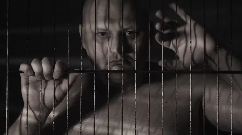 Prisoner in jail cell Stock Footage 8607029