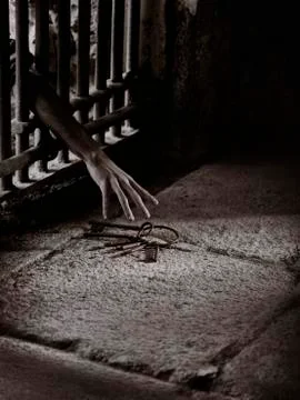 Prisoner reach for the key Stock Photos