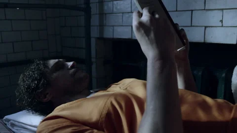 A prisoner reading a book Stock Footage 283090109