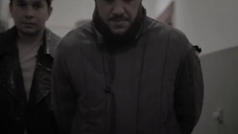 Prisoner in a Soviet prison lead along the corridor 動画素材 126035249