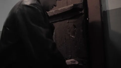 Prisoner in a Soviet prison lead along the corridor 動画素材 126035299