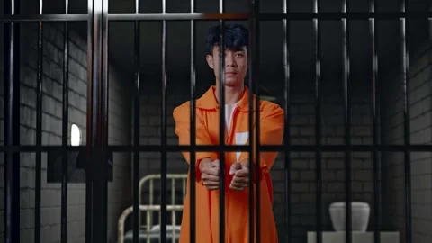 Prisoner Stretching Out The Hands Surrender Himself In Prison Stock Footage 273253769