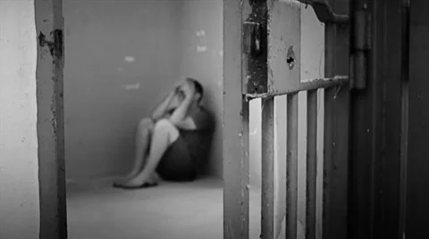 Prisoner suffers in cell 스톡 동영상 32077703