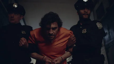 Prisoner taken to his cell by force Stock Footage 283088346