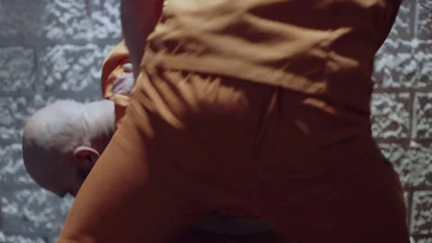 Prisoners beating another prisoner during a basketball game Video stock 283082235