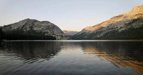 Pristine Alpine Lake with Mountain Reflection at Sunset Stock Photos