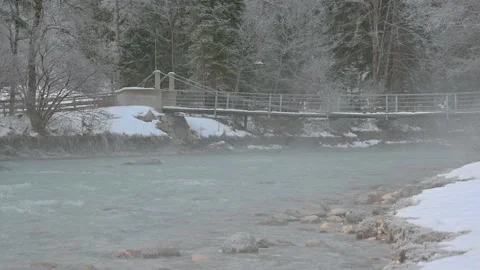 Pristine Alpine river flowing downstream in winter season Stock Footage 145532756