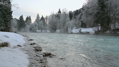 Pristine Alpine river flowing downstream in winter season Stock Footage 145532806