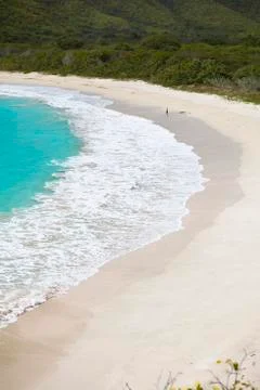 The pristine and hard to reach beach in the Rendezvous Bay in Antigua. Stock Photos