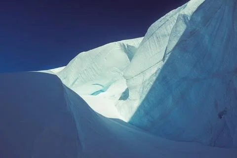 A pristine Antarctic scene of endless ice, massive icebergs, and flowing Stock Photos