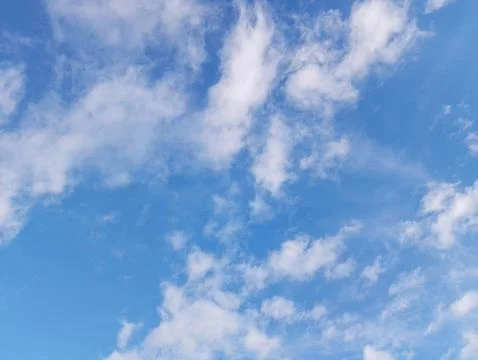 Pristine Azure Sky with Dancing Cotton Clouds: Nature's Perfect Canvas Stock Photos
