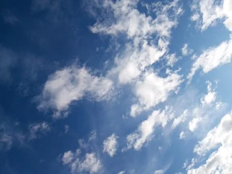 Pristine Azure Sky with Dancing Cotton Clouds: Nature's Perfect Canvas Stock Photos