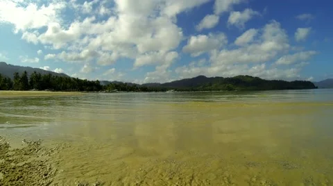 Pristine bay view with clouds running fast through blue sky. 4K time lapse. Stock Footage 49088029