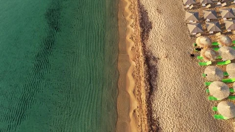 Pristine Beach Aerial with Umbrellas and Turquoise Waters Stock Footage 317238972