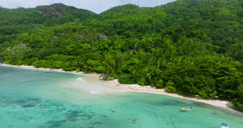 Pristine beach with crystal-clear waters and greenery. Seychelles, Mahe. Stock Footage 311492265