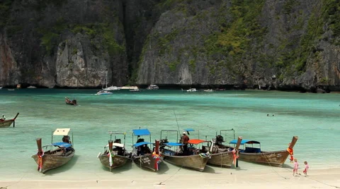 Pristine beach, Long tail wooden boats at Maya Bay, Phi phi island Stock Footage 2892986