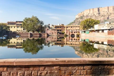 Pristine calm lake with water reflection of vintage architecture around at .. Stock-Fotos