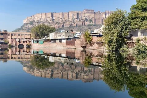 Pristine calm lake with water reflection of vintage architecture around at .. 写真素材