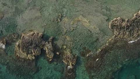 Pristine Coastal Elegance: Aerial View of Turquoise Waters and Rugged Coastline Stock Footage 263094281