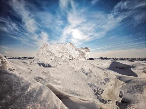 Pristine ice formation sparkling under clear winter sky Stock Photos
