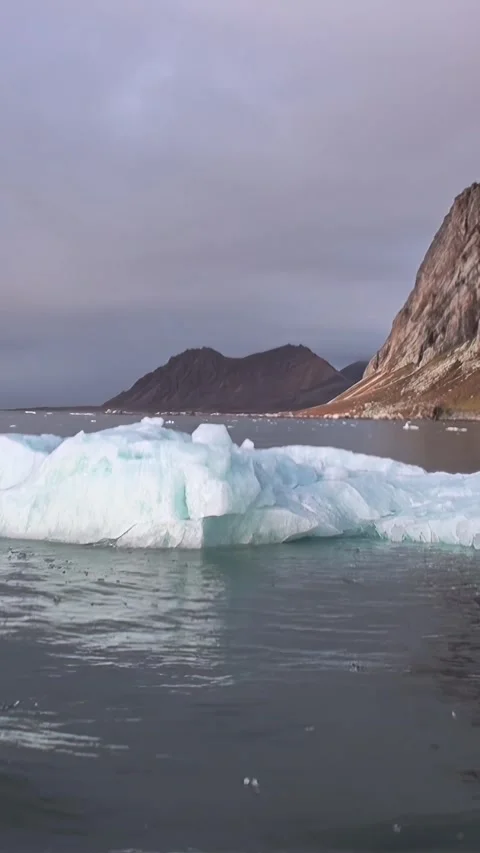 Pristine Iceberg Navigates Svalbard's Chilling Arctic Waters Stock Footage 340483346