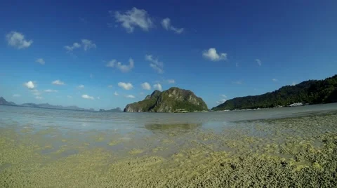 Pristine Philippines beach surrounded by rock formations. 4K time lapse. Stock Footage 49088018