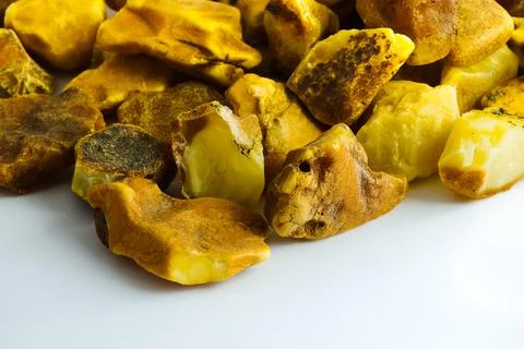 Pristine Polish Baltic amber in raw form on a white background, perfect for.. Stock Photos
