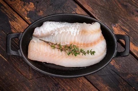 Pristine raw cod fillet, waiting to be marinated and cooked to perfection f.. Stock Photos