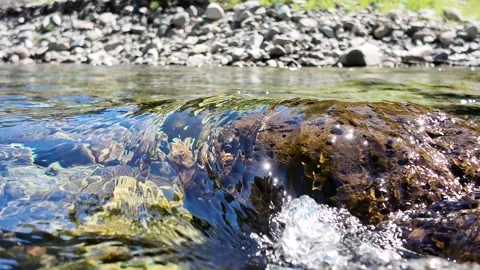 Pristine River Flow over River Rock Stock Footage 278281165