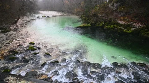 Pristine river flowing downstream in alpine valley Stock Footage 173007124
