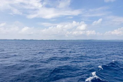 Pristine Sea View with Waves and Bright Blue Sky on Sunny Day Stock Photos
