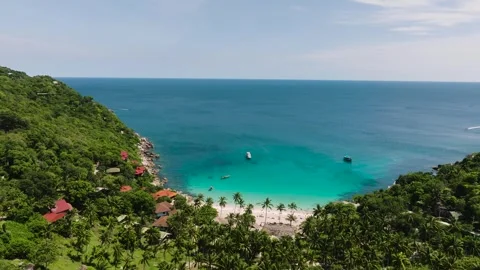 Pristine tropical bay with turquoise waters and green hills. Koh Tao, Thailand. Stock Footage 297176262