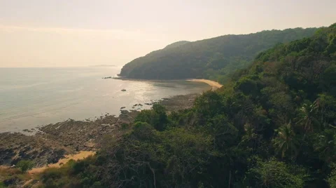 Pristine tropical forest and sea in Thailand. Slight camera movement, aerial N. Stock Footage 63837271