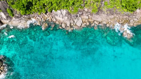 Pristine turquoise bay with rocky shore and green vegetation. Seychelles, Mahe. Stock Footage 312430523