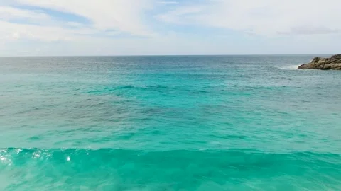 Pristine turquoise ocean waters near a tropical beach. Seychelles, Mahe. Stock Footage 303472561