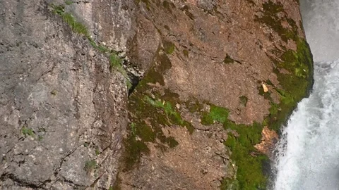 Pristine waterfall flowing downstream in Alps mountain Stock Footage 137152533