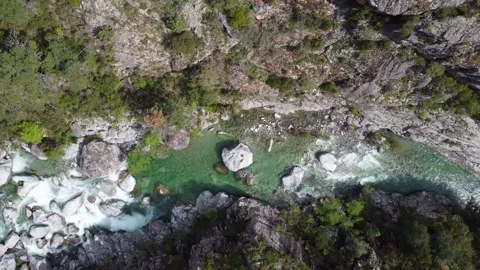 Pristine Waters and Rugged Terrain: A Bird's Eye View of Nature's Masterpiece Stock Footage 253585676