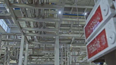 Pristine white chemical production facility with shiny chrome piping and sensors Stock Footage 312564641
