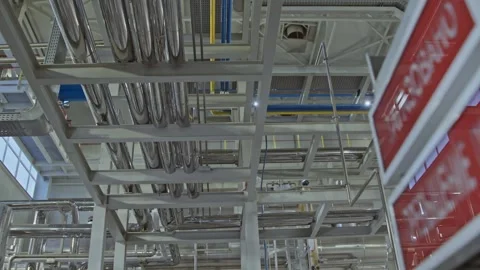 Pristine white chemical production facility with shiny chrome piping and sensors Stock Footage 316142993