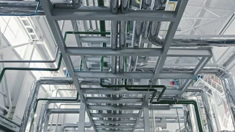 Pristine white chemical production facility with shiny chrome piping and sensors Stock Footage 316143209