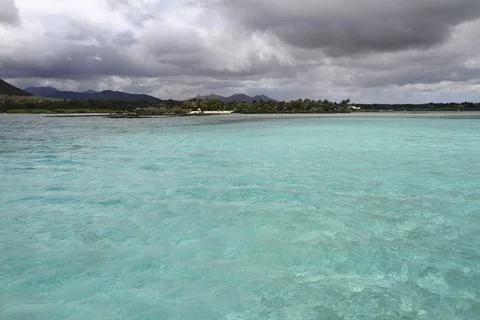 A Pristine White Sandy Beach Meets the Clear Turquoise Ocean, Mauritius 写真素材