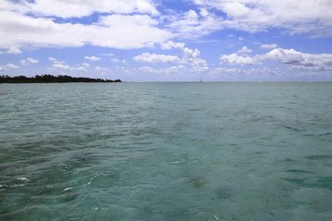 A Pristine White Sandy Beach Meets the Clear Turquoise Ocean, Mauritius 写真素材