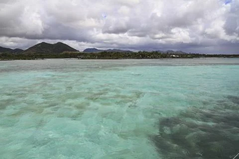 A Pristine White Sandy Beach Meets the Clear Turquoise Ocean, Mauritius 写真素材