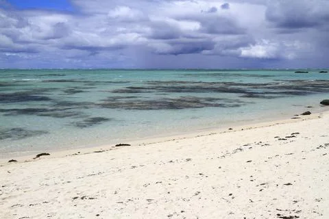 A Pristine White Sandy Beach Meets the Clear Turquoise Ocean, Mauritius 写真素材
