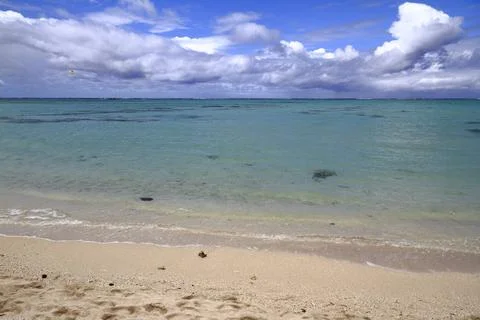 A Pristine White Sandy Beach Meets the Clear Turquoise Ocean, Mauritius 写真素材