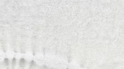 Pristine white textured fabric with subtle gray drips cascading downward evok Stock Photos