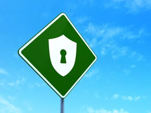 Privacy concept: Shield With Keyhole on road sign background Illustrazione stock