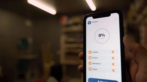 Privacy settings app on smartphone screen showing full protection and permission Stock Footage 342603625